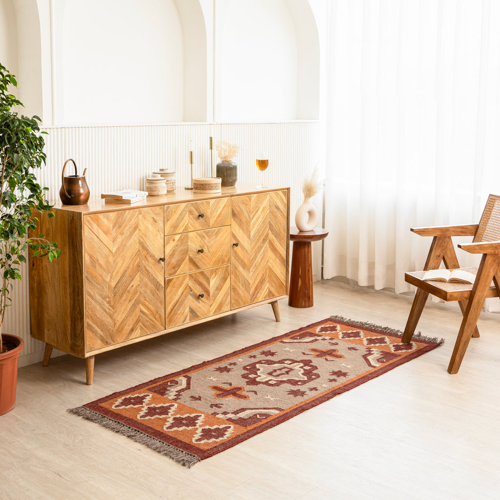 Jute Boho Runner with wooden sideboard and decorative items in a bright room.