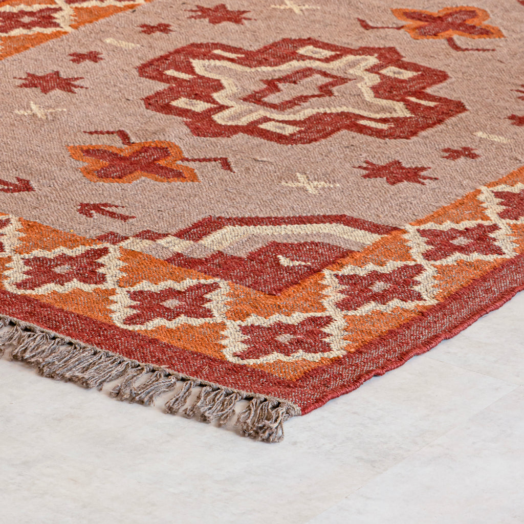 kilim rug with traditional design on a plain background