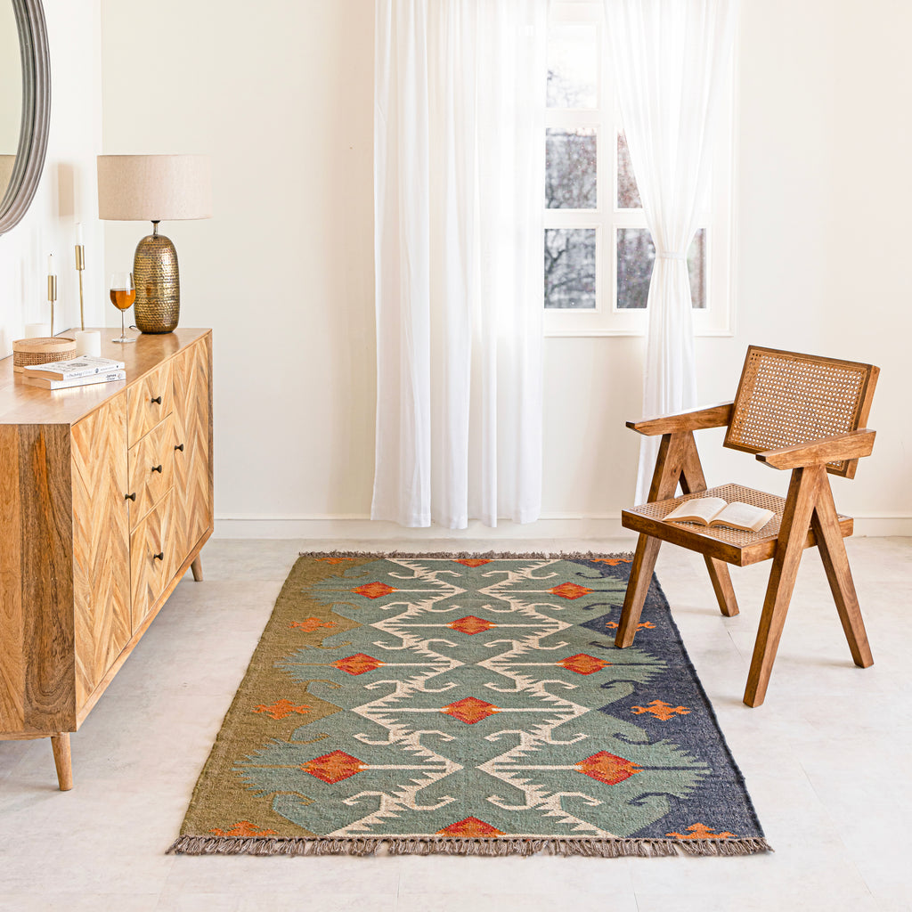 Jute Kilim Rug in Living room with wooden furniture,and a chair.
