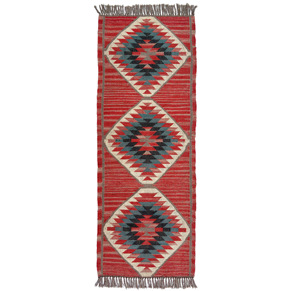 Woven kilim runner rug with geometric pattern on a white background