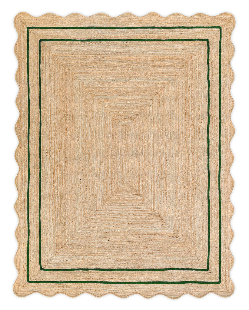 A rectangular jute area rug with a wave scalloped edge and green border.